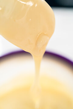 Pouring icing close up dessert preparation