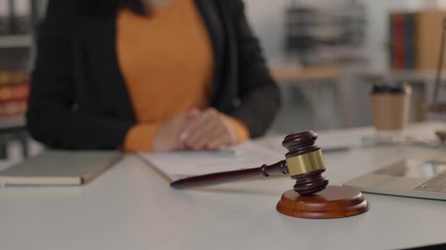 Female judge presiding in courtroom awaiting trial