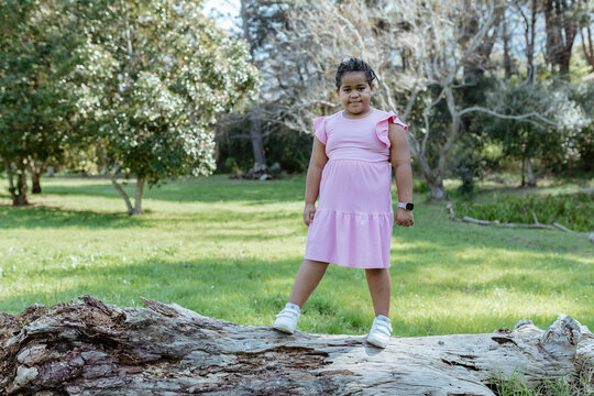 Young mixed race girl playing outdoors