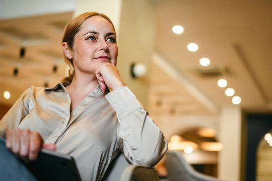Professional woman with laptop in a modern caffee