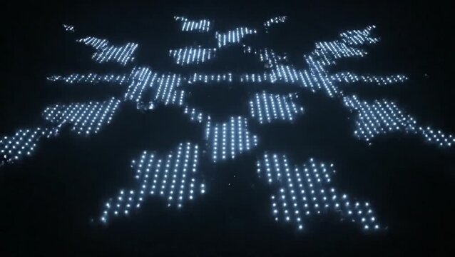 Digital snowflake pattern made of glowing blue lights on a dark background.