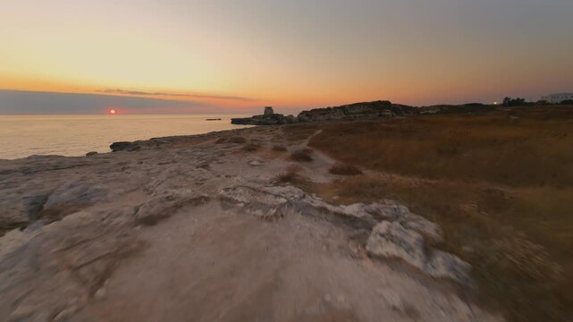 Roca Vecchia - La torre e il mare - Salento - Puglia - volo con drone FPV all'alba