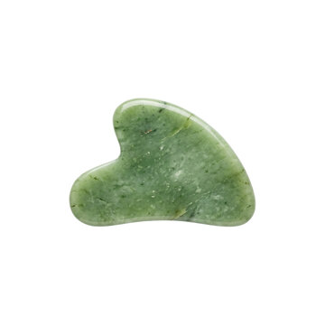 Green jade gua sha tool for facial massage. Natural stone scraper for skincare routine. Heart shaped aventurine massager on white background.