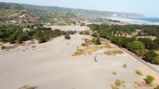 Aerial View of Gumuk Pasir Parangkusumo Sand Dunes, Coastal Village and Parangtritis Beach in Yogyakarta
