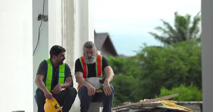  Exhausted construction workers with burnout resting tired and stressed at house building site