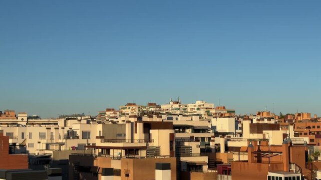 Cityscape panning revealing residential apartment buildings rooftops