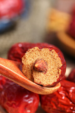 Xinjiang Hetian Red Jujube Dried Fruit on Wooden Spoon - Traditional Chinese Superfood Still Life Photography