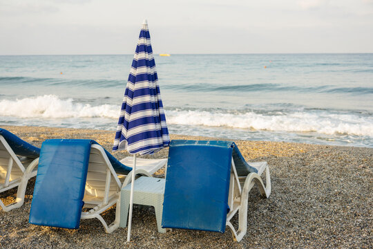 Beach with Sun Loungers and umbrella on sea in Alanya, Turkey