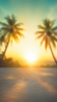 Blurred tropical beach sunset with palm trees and ocean horizon.
