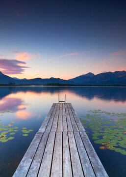 Idyllic Alpine Lake with Wooden Pier at Sunset