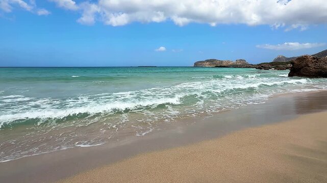 Calm Turquoise Sea Waves on Sandy Beach in Crete, Greece,waves, foam, sea foam, turquoise water, blue water, wet sand, sand, shoreline, horizon, blue sky, clouds, cliffs, rocky coast, headland, bay, c