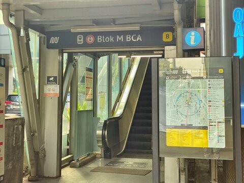 Jakarta, Indonesia - July 17, 2026: A public transport map and exit directory on an information board next to an escalator inside Blok M BCA MRT Station.