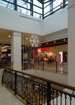 Shopping mall interior with Christmas lights and snowflake decoration