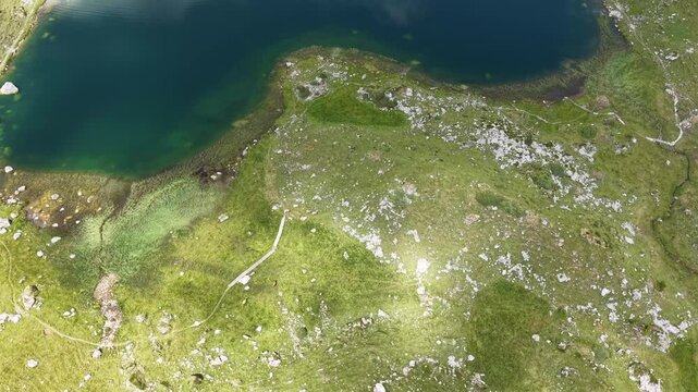Drone view at the lake of Seefeldsee near Aelggialp geografic center of Switzerland on the Swiss alps