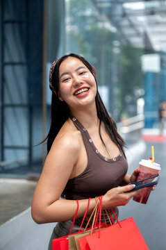 Medium Close Up Portrait of Happy Asian Shopping Woman