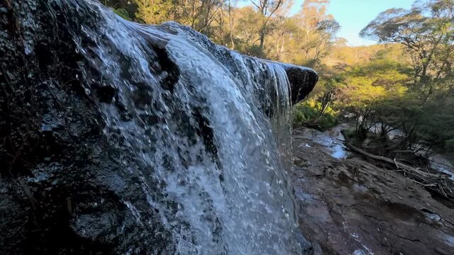Waterfall Cascading Over Rock Ledge in Blue Mountains National Park