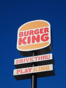 Burger King restaurant sign against blue sky
