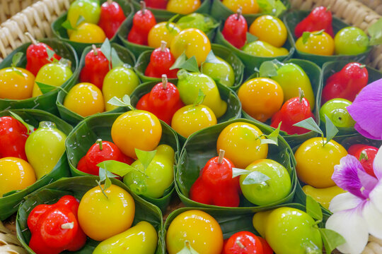 Traditional Thai Mung Bean Marzipan Dessert Khanom Luk Chup Full Frame.Khanom Luk Chup, a traditional Thai dessert made from sweetened mung bean paste molded into glossy miniature fruits 