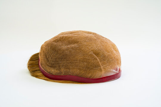 Golden wig on white background