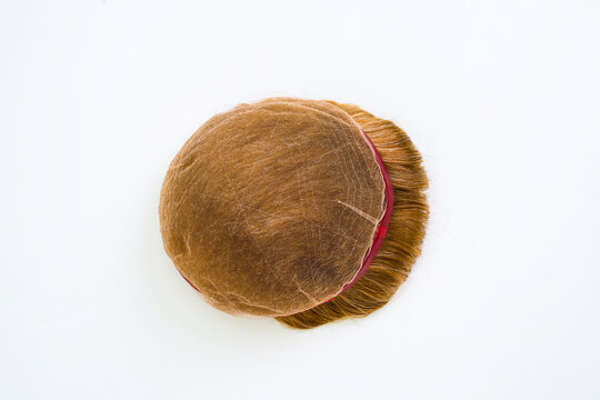 Golden wig on white background
