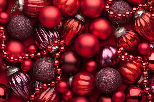 Luxury background of Christmas ornaments in red, burgundy  and plum tones  with various textures.  Flat lay