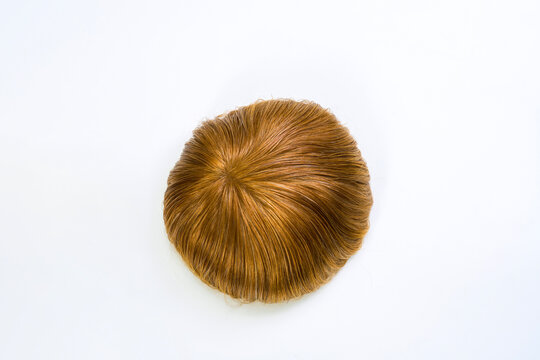 Golden wig on white background