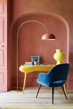 Home office corner with a citron desk, lamp and electric blue velvet chair under a pink arch, creative workspace, bold color decor, dopamine decor, productive mood.