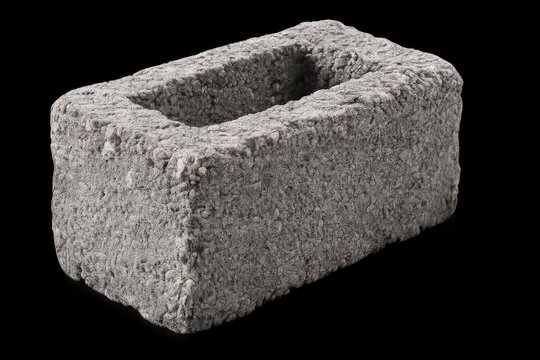 Single Hollow Concrete Cinder Block Isolated on Black Background Construction Material