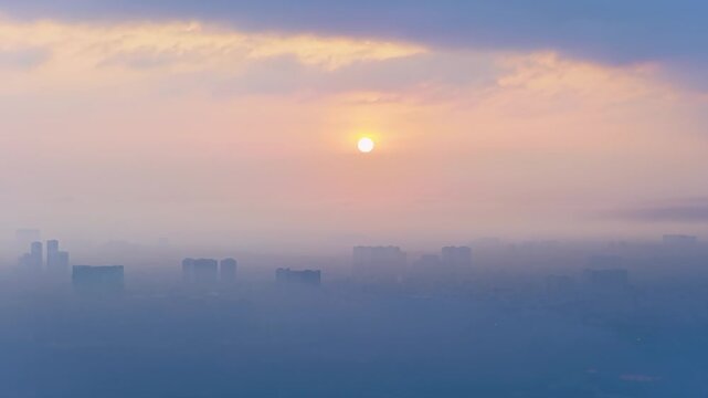 Aerial view of Saigon cityscape at morning with misty sky in Southern Vietnam. Urban development texture, transport infrastructure and green parks