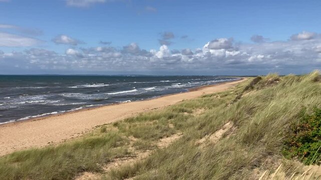 Wide View of Mellbystrand Beach with Halmstad on the Horizon on a Windy Summer Day