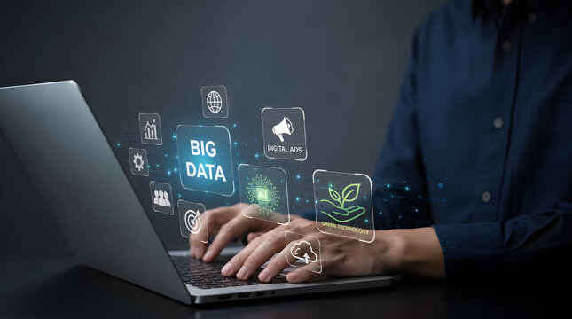 Business professional typing on a laptop to manage big data and digital marketing strategies with modern technology