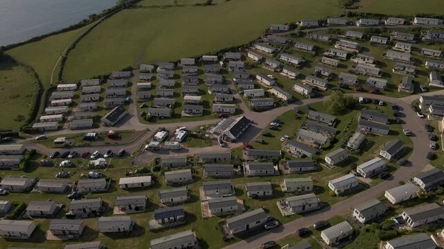 Aerial view of Seaton Holiday Caravan Park in Devon, showing rows of static caravans, this footage captures holiday accommodation, coastal scenery, and the peaceful atmosphere of a seaside retreat.