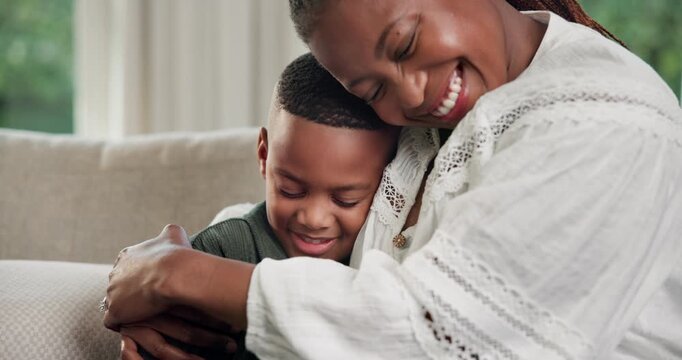 Mom, son or love with hug on sofa for comfort, childhood care or bonding together in home. Happy, mother and smile with child, kid or embrace on couch for affection, weekend break or holiday in house