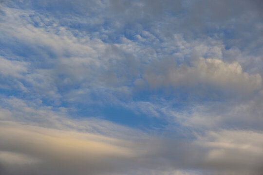 Natural backgrounds and textures. Cirrus and stratus clouds in soft light against the September sky in Europe.
