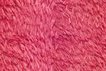 Fototapeta premium Bright pink fabric texture featuring soft fluffy fibers as seamless background pattern for creative design projects display or professional textile surface.