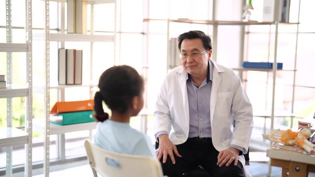 Senior doctor examining injured child leg in medical clinic, pediatric orthopedic assessment, physical examination, healthcare consultation, child injury treatment, hospital care.