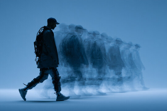 Stroboscopic multiple exposure of a man walking