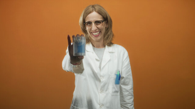 Woman doctor in white coat holding a container of cotton swabs with an outstretched hand in studio; reassuring care.