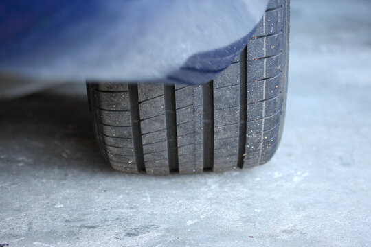 Abstract view of an overinflated new tire