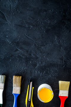 set of tools for build, paint and repair house on dark background top view mock-up