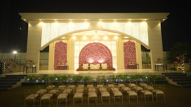Illuminated Outdoor Wedding Stage Decoration at Night