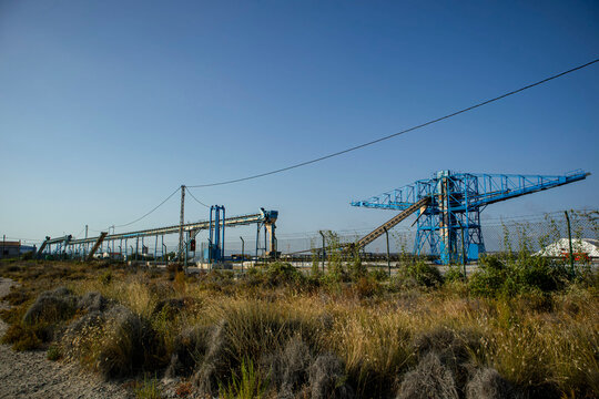 Salt production at the salt works factory with crane conveyor system in Santa Pola Spain