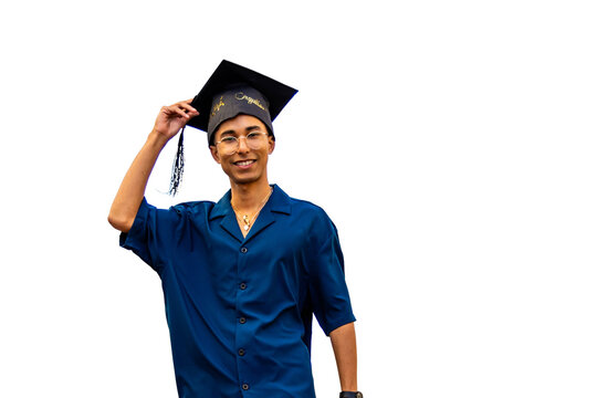 Young man celebrating graduation achievement smiling, holding cap with tassel. PNG