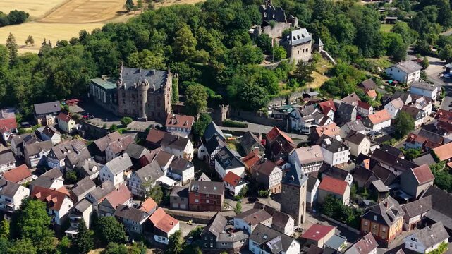 Panoramic aerial view of the old town city Staufenberg in Germany on a sunny afternoon
