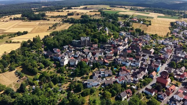 Panoramic aerial view of the old town city Staufenberg in Germany on a sunny afternoon