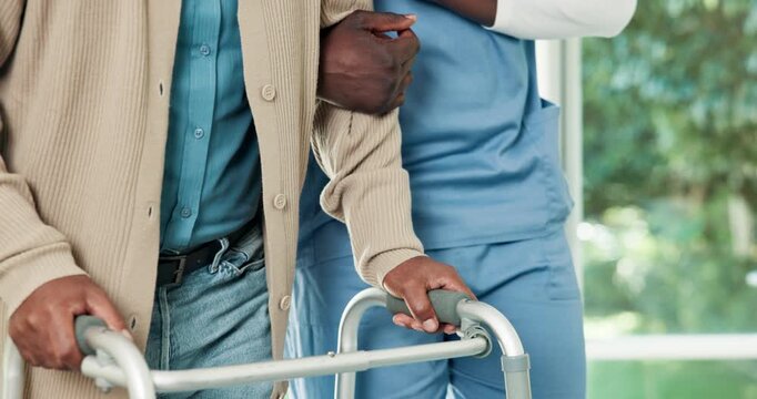 Physio, hands and support man with walker for exercise, movement and injury rehabilitation in clinic. Healthcare worker, help and person with mobility aid, physical therapy and healing from stroke.