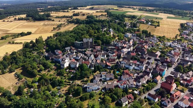 Panoramic aerial view of the old town city Staufenberg in Germany on a sunny afternoon
