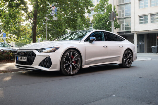 DRESDEN, GERMANY - 4. August 2026: Audi RS7 C8 in white color parking on street. Sporty hatchback design of car. Powerful premium vehicle of German manufacturer.