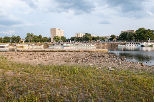 DRESDEN, GERMANY - 4. August 2026: Foundation of Carola bridge (Carolabr&uuml;cke) building during low water level in the Elbe river. Concrete basis leftover in the riverbed as part of the infrastructure.