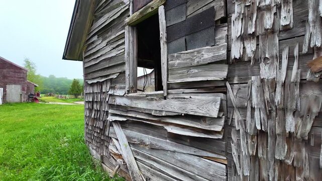 Dilapidated old wooden shed with crumbling shingles on a farm in Leelanau County, Michigan